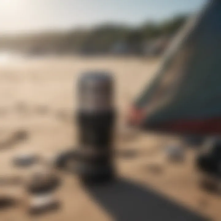 Essential camping gear arranged on a sandy beach