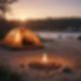 Serene beach campsite at sunset with tents and campfire