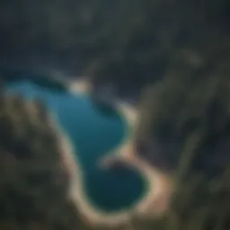 Aerial view of Lake Arrowhead surrounded by dense forests and mountains